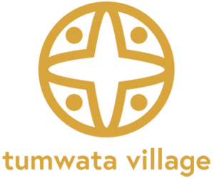 Tumwata village logo in gold.